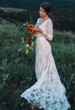 Backless wedding dress with shaped cut from behind by Anna Skoblikova