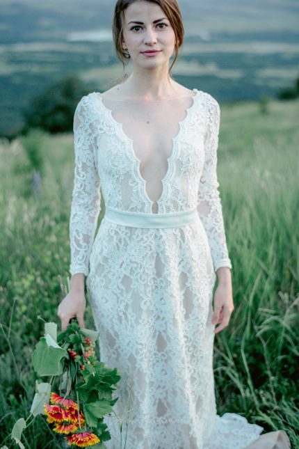 Backless wedding dress with shaped cut from behind by Anna Skoblikova