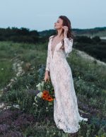 Backless wedding dress with shaped cut from behind by Anna Skoblikova