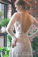 Ivory wedding dress with v-neck cut and open back by Anna Skoblikova
