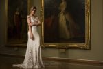 Photo 1: Wedding dress trimmed with tapework lace